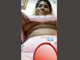 Watch a stunning girlfriend flaunt her ample bosom in a video call
